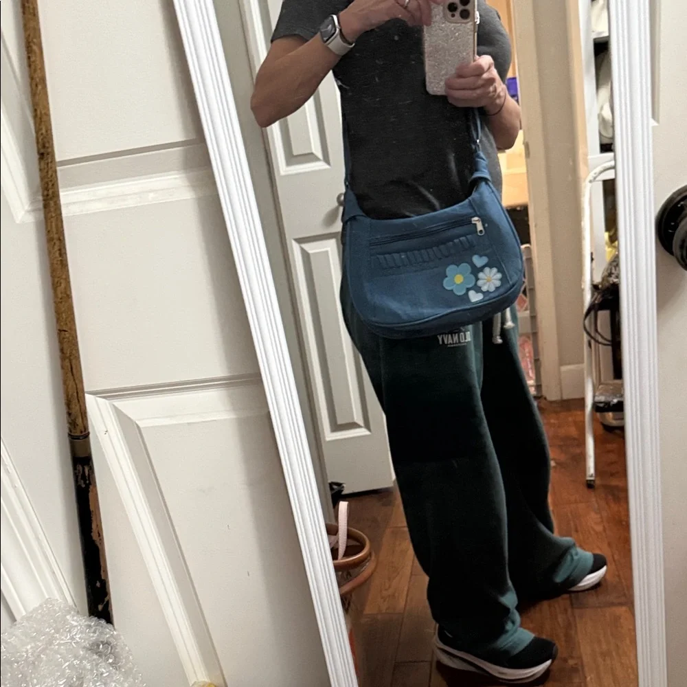 Chic Blue Denim Hobo Bag with Floral Accents